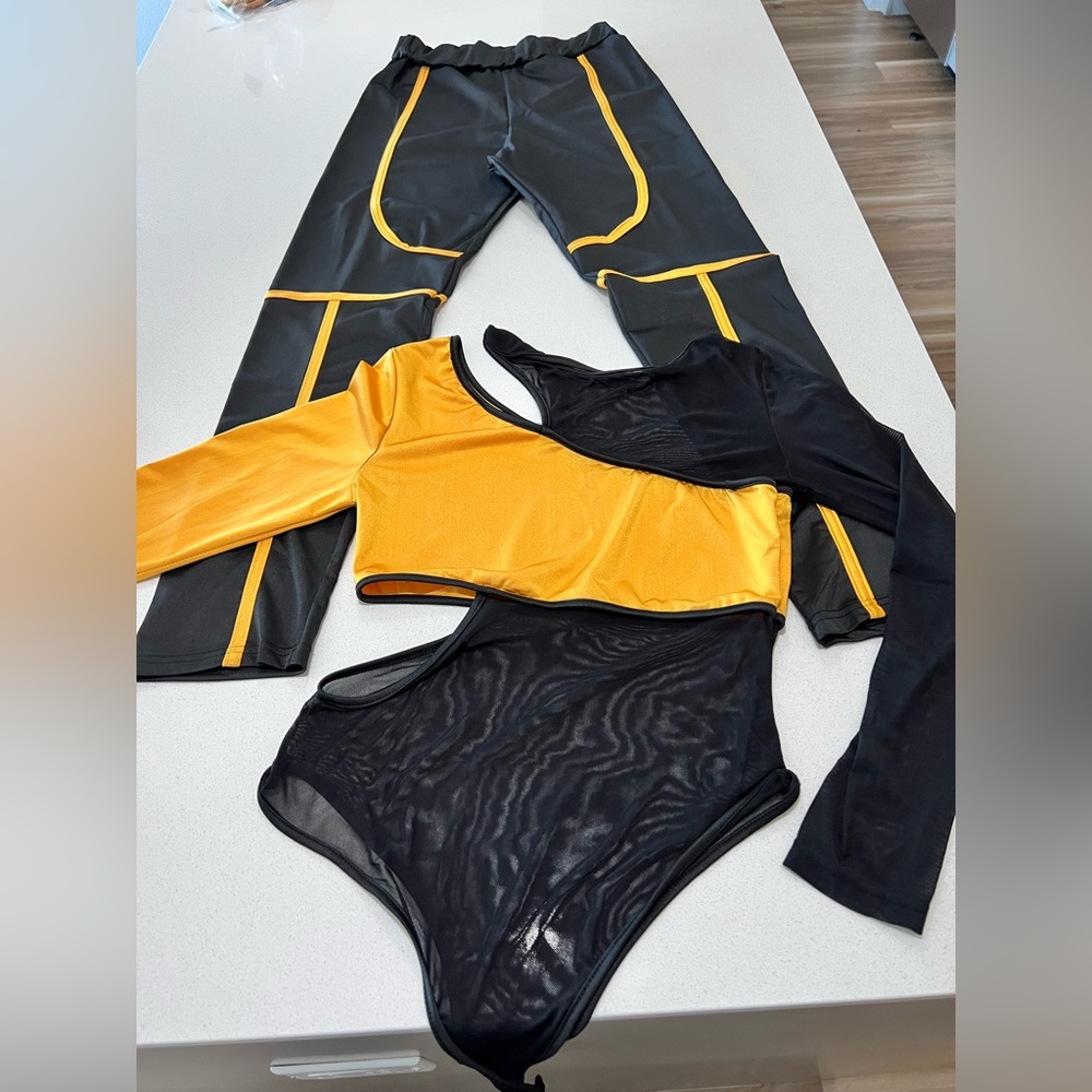 Woman’s black and gold fitted pantsuit. Brand new, never worn